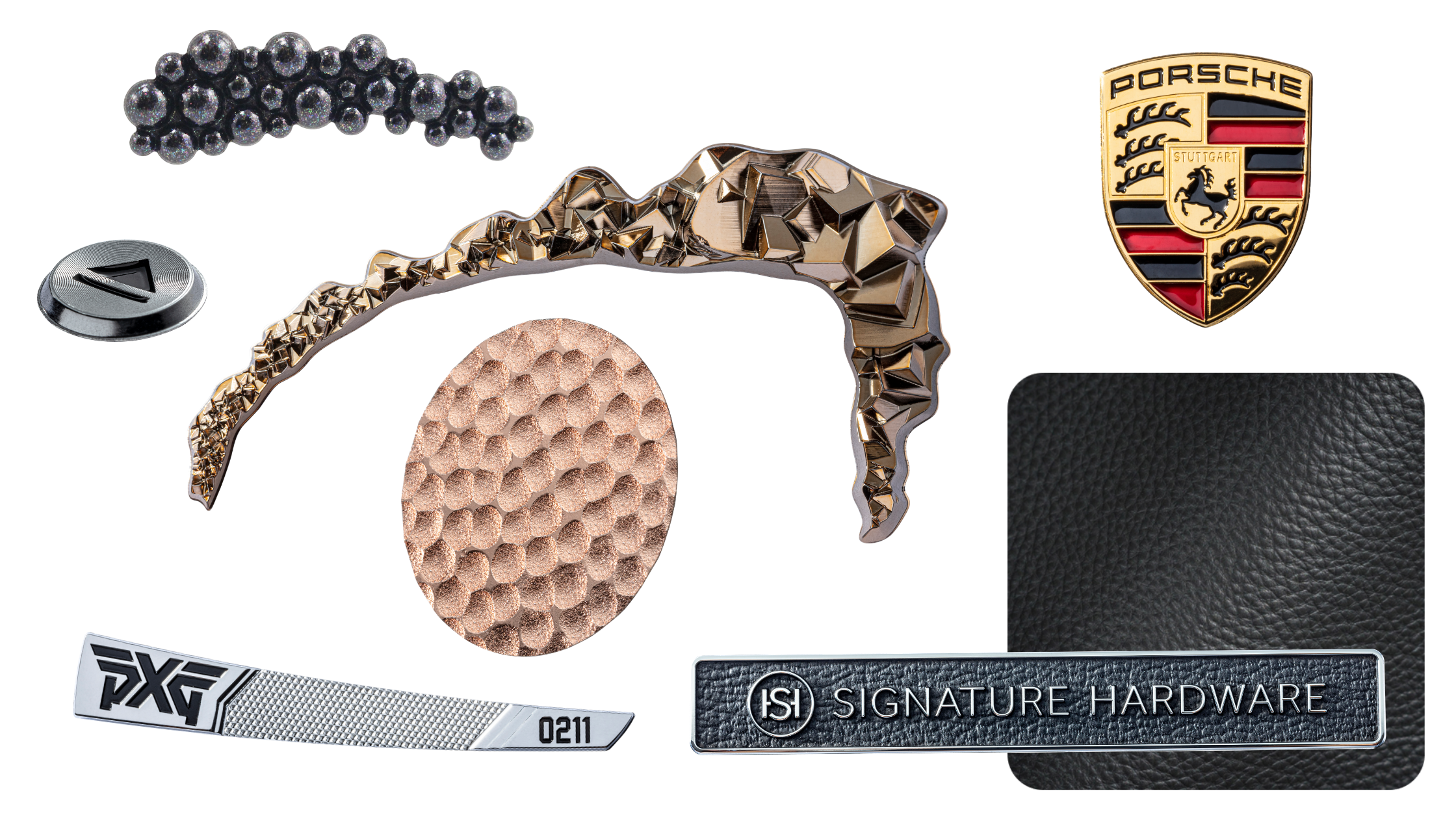 collage of name plates. black iridescent sloped piece with 3D bubbles, rose gold faceted curved trim piece, rose gold hammered metal circle piece, porsche logo, swatch of black leather, leather name plate, chrome plated golf emblem